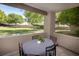 Cozy outdoor patio with seating area overlooking a landscaped green space at 2146 W Isabella Ave # 154, Mesa, AZ 85202