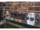 Stainless steel flat top range with brick backsplash at 2146 W Isabella Ave # 154, Mesa, AZ 85202