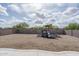 Backyard featuring gravel landscaping and a wooden playset at 21882 N 260Th Ln, Buckeye, AZ 85396