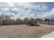 Backyard with playground, surrounded by a block wall and gravel at 21882 N 260Th Ln, Buckeye, AZ 85396
