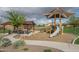 Community playground with picnic area, grill, slide, and shade, for Gathering fun and outdoor gatherings at 21882 N 260Th Ln, Buckeye, AZ 85396