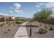 Scenic walking path with native desert landscaping and mountain views in a well-maintained community at 21882 N 260Th Ln, Buckeye, AZ 85396