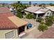 Aerial view of home showing backyard featuring a covered patio and desert landscaping at 2380 E Seville Ct, Casa Grande, AZ 85194