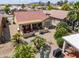 Aerial view of a home highlighting the covered patio and lush desert landscaping at 2380 E Seville Ct, Casa Grande, AZ 85194