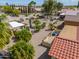 Aerial view of landscaped backyard featuring covered patio with outdoor seating at 2380 E Seville Ct, Casa Grande, AZ 85194