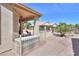 Well maintained backyard featuring desert landscaping and covered patio with brick flooring at 2380 E Seville Ct, Casa Grande, AZ 85194