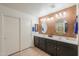 Bathroom with dual sinks, decorative mirrors and large cabinets at 2380 E Seville Ct, Casa Grande, AZ 85194