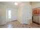 Bright entryway with tile flooring, leading to the laundry room and front door at 2380 E Seville Ct, Casa Grande, AZ 85194