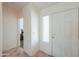 Bright entryway featuring tile flooring and a view into a bedroom at 2380 E Seville Ct, Casa Grande, AZ 85194
