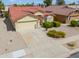 Charming single-Gathering home with desert landscaping, a two-car garage, and well-maintained front yard at 2380 E Seville Ct, Casa Grande, AZ 85194