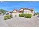 Single-story home with low-maintenance desert landscaping and a two car garage at 2380 E Seville Ct, Casa Grande, AZ 85194