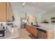 Bright open kitchen with breakfast bar, stainless appliances, and a pantry at 2380 E Seville Ct, Casa Grande, AZ 85194