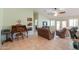 Open-concept living room with desk space, bright light, and patio access at 2380 E Seville Ct, Casa Grande, AZ 85194