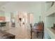 Spacious living area featuring tile flooring, neutral paint, and an antique desk at 2380 E Seville Ct, Casa Grande, AZ 85194