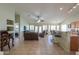 Open living space features tile floors, a ceiling fan, and abundant natural light at 2380 E Seville Ct, Casa Grande, AZ 85194