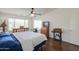 Spacious main bedroom featuring wood-look flooring, dual pane windows and a ceiling fan at 2380 E Seville Ct, Casa Grande, AZ 85194