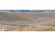 Panoramic aerial shot of the property showcases its proximity to the highway and neighboring community at 2523 W Running Deer Trl, Phoenix, AZ 85085