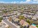 An aerial view shows a neighborhood's layout with desert landscaping at 2523 W Running Deer Trl, Phoenix, AZ 85085