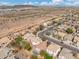 Breathtaking aerial view showcases the neighborhood featuring homes, trees, and sparkling blue swimming pools at 2523 W Running Deer Trl, Phoenix, AZ 85085