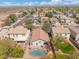 Backyard kidney-shaped pool of single-Gathering home nestled in a vibrant community with a backdrop of distant mountains at 2523 W Running Deer Trl, Phoenix, AZ 85085