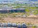 An aerial view shows a large office complex with lots of parking in a desert landscape at 2523 W Running Deer Trl, Phoenix, AZ 85085