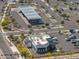 Aerial view shows a gas station, diner and busy streets with desert landscape at 2523 W Running Deer Trl, Phoenix, AZ 85085
