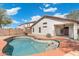 Private backyard featuring a pool and covered patio area, perfect for entertaining at 2523 W Running Deer Trl, Phoenix, AZ 85085