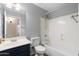 Clean bathroom featuring a single sink vanity, toilet, and shower-tub combination at 2523 W Running Deer Trl, Phoenix, AZ 85085