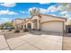 Lovely single-story house featuring a two-car garage, desert landscaping, and a spacious driveway at 2523 W Running Deer Trl, Phoenix, AZ 85085