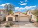 Charming single-Gathering home features a well-maintained front yard, desert landscaping and attached two-car garage at 2523 W Running Deer Trl, Phoenix, AZ 85085