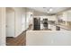 Bright kitchen featuring stainless steel appliances, granite countertops, and white cabinetry at 2523 W Running Deer Trl, Phoenix, AZ 85085