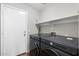 Well-organized laundry room with a modern washer and dryer set at 2523 W Running Deer Trl, Phoenix, AZ 85085