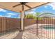 Covered patio overlooking a fenced pool area and landscaped backyard at 2523 W Running Deer Trl, Phoenix, AZ 85085