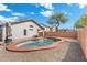 Backyard pool with charming desert landscaping, and privacy fence, perfect for relaxing on warm Arizona days at 2523 W Running Deer Trl, Phoenix, AZ 85085
