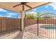Serene outdoor pool area with an iron safety fence for peace of mind and relaxation at 2523 W Running Deer Trl, Phoenix, AZ 85085