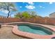 Backyard kidney-shaped pool with private fence provides a relaxing escape from hot summer days at 2523 W Running Deer Trl, Phoenix, AZ 85085