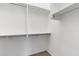 Neat walk-in closet featuring metal racks and shelving at 2523 W Running Deer Trl, Phoenix, AZ 85085