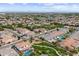 Panoramic aerial view of a residential area with parks, community pools, and well-kept homes, highlighting the neighborhood's amenities at 2664 E Ebony Dr, Chandler, AZ 85286