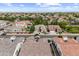 Wide aerial shot showcasing a residential area with consistent architecture, tidy streets, and clear blue skies above tiled roofs at 2664 E Ebony Dr, Chandler, AZ 85286