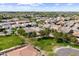 Scenic aerial perspective of a community lined with mature trees, green spaces, and neatly arranged residential properties at 2664 E Ebony Dr, Chandler, AZ 85286