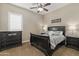 Comfortable guest bedroom features dark wood furniture, a cozy bed, and a ceiling fan for added comfort at 2664 E Ebony Dr, Chandler, AZ 85286