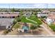 Bird's-eye view of a neighborhood park with a playground, walking paths, and shaded benches, surrounded by homes at 2664 E Ebony Dr, Chandler, AZ 85286