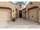 Welcoming home exterior showcasing a charming entryway with a front door, covered porch, and desert landscaping at 2664 E Ebony Dr, Chandler, AZ 85286