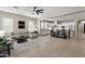 Spacious open-concept living room with modern furnishings flows into the bright kitchen and dining area at 2664 E Ebony Dr, Chandler, AZ 85286