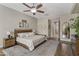 Spacious main bedroom features a king bed, ensuite bathroom, and stylish decor at 2664 E Ebony Dr, Chandler, AZ 85286