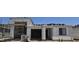 New home construction shows the exterior with a garage and scaffolding for adding finishing touches at 32139 N Lone Rancher Way, San Tan Valley, AZ 85140
