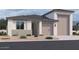 Charming single-story home with a two-car garage and low-maintenance landscaping at 32139 N Lone Rancher Way, San Tan Valley, AZ 85140