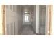 Hallway view shows walls ready for paint, awaiting the final touches to transform this space at 32139 N Lone Rancher Way, San Tan Valley, AZ 85140