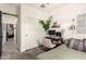 Neutral guest bedroom with a desk, closet, and gray-green bedding at 3219 W Pollack St, Phoenix, AZ 85041