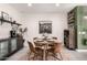 Charming dining area featuring stylish decor, a modern light fixture, and a cozy atmosphere for meals at 3219 W Pollack St, Phoenix, AZ 85041